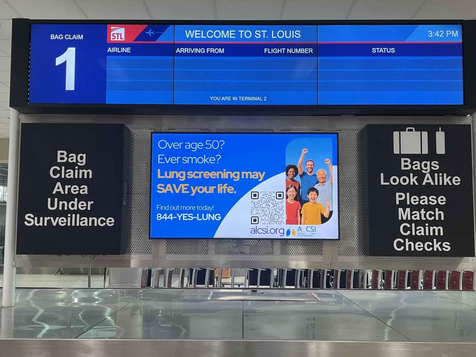 Digital lung cancer screening information above an airport baggage carousel