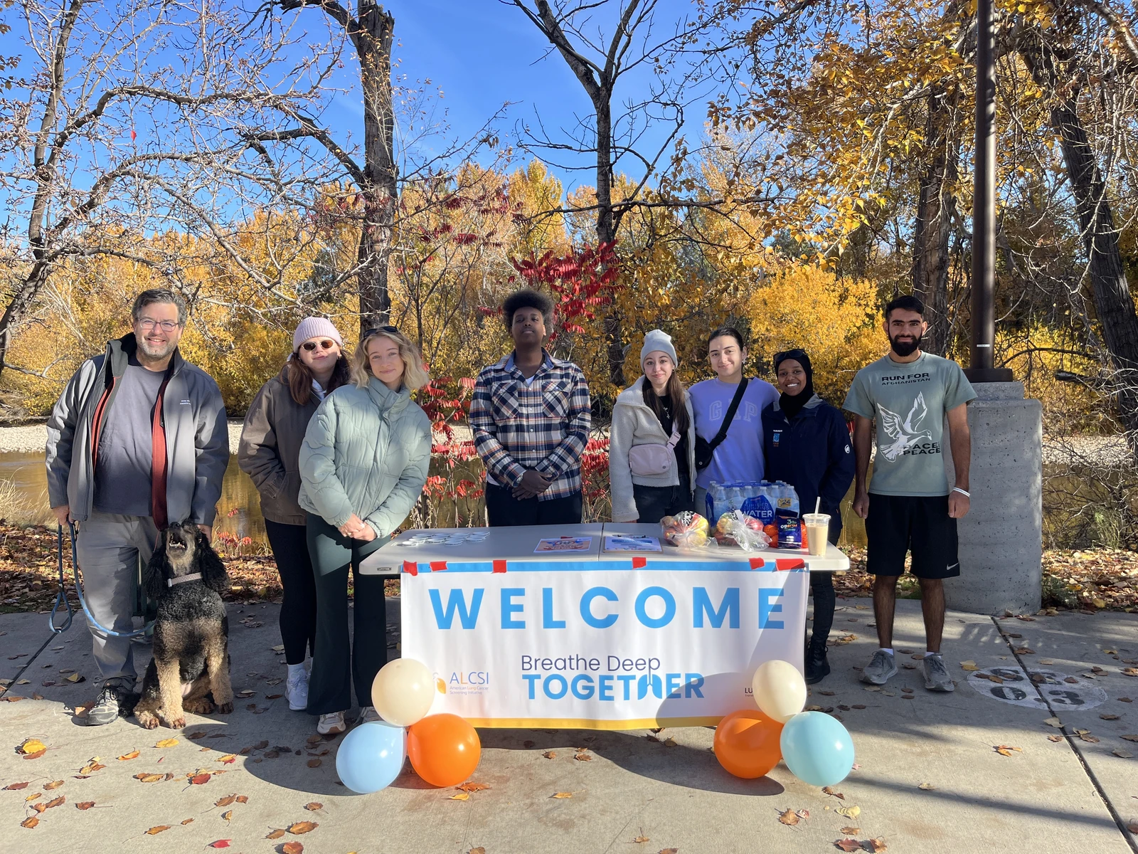 Participants welcoming walkers to a lung cancer awareness event