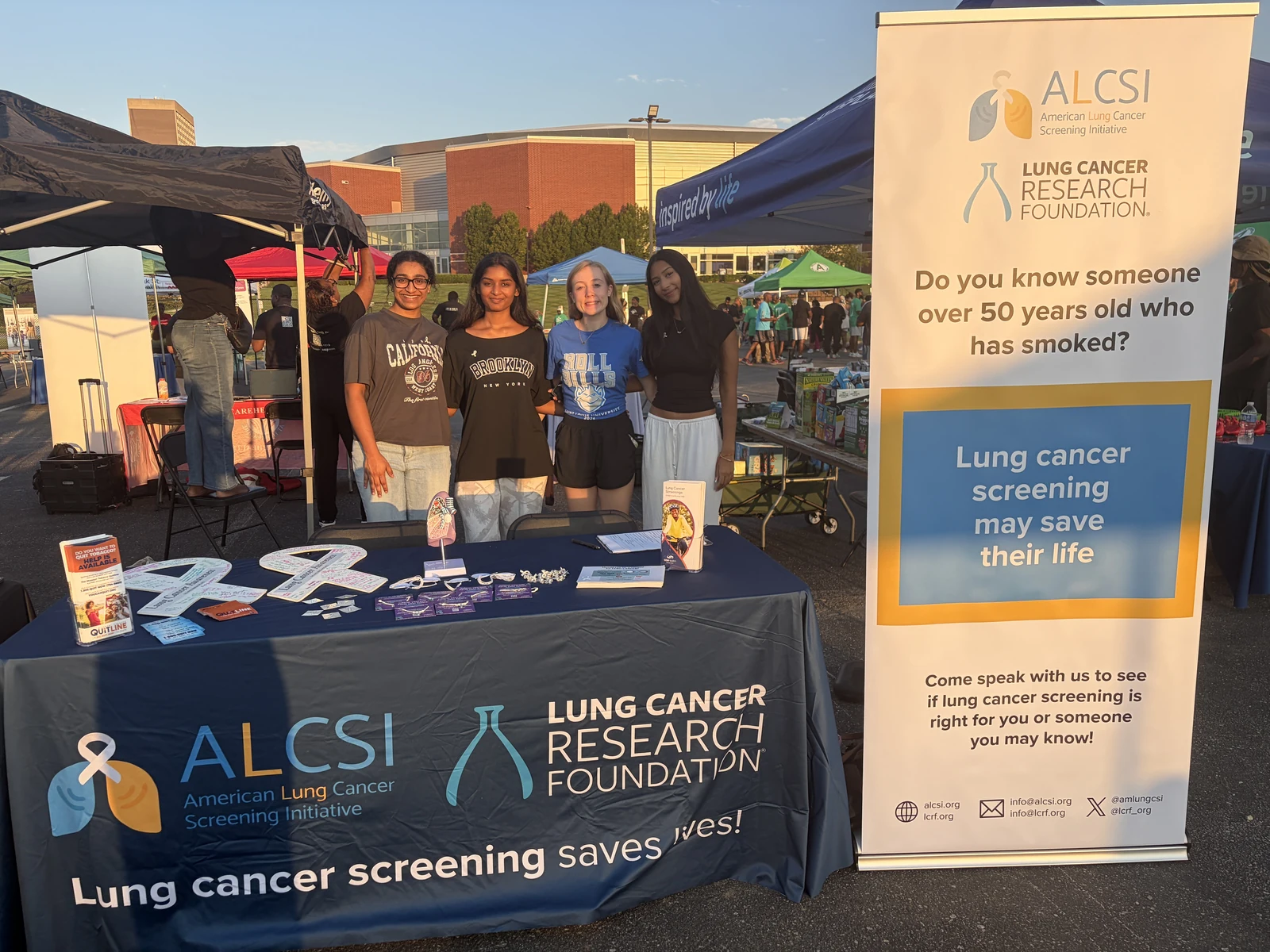 ALCSI volunteers sharing screening information at an outdoor community event