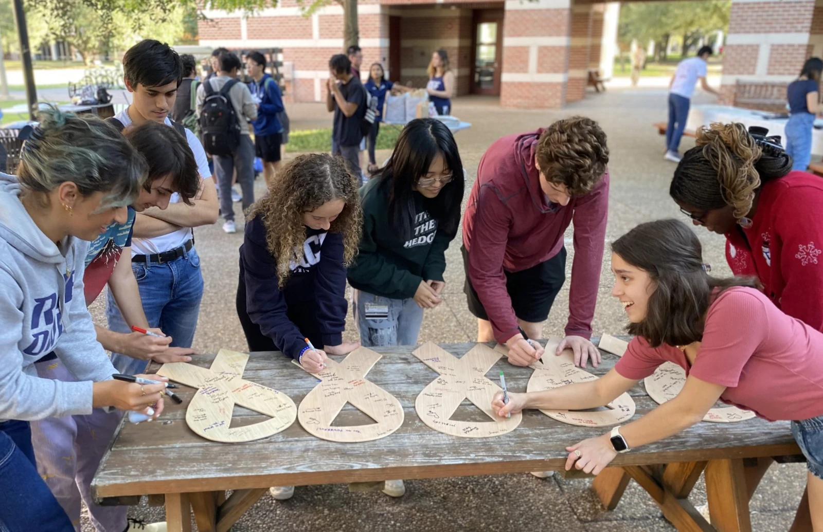 ALCSI volunteers preparing white lung cancer awareness ribbons