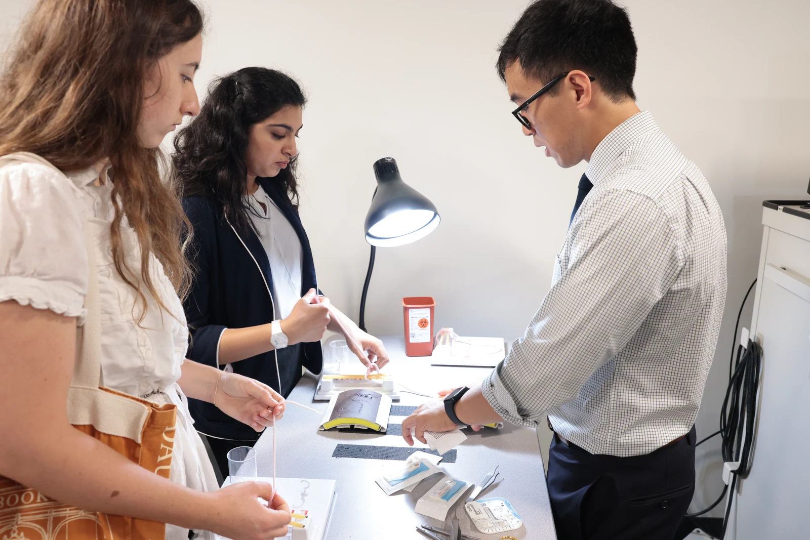 ALCSI summit participants exploring a clinical research exhibit