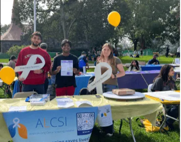 Volunteers staffing an ALCSI information tent outdoors