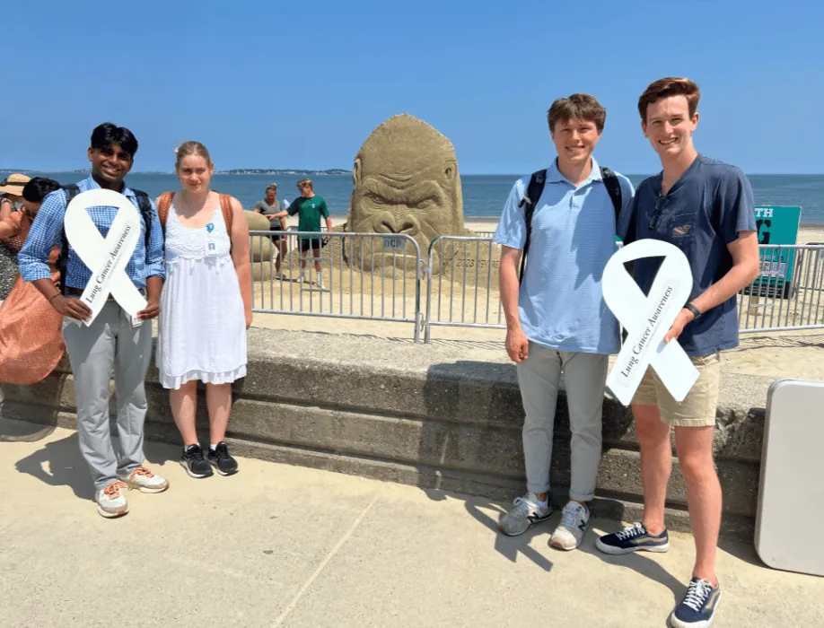 ALCSI advocates holding white ribbons outdoors