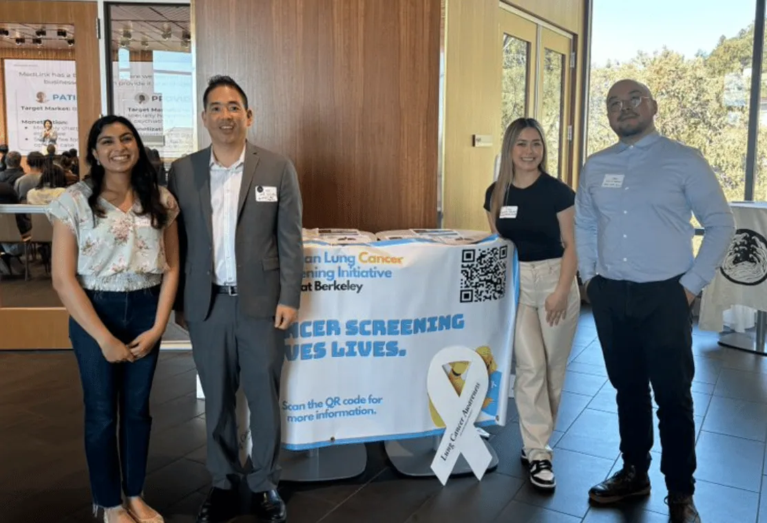 ALCSI members standing together at a cancer center outreach event