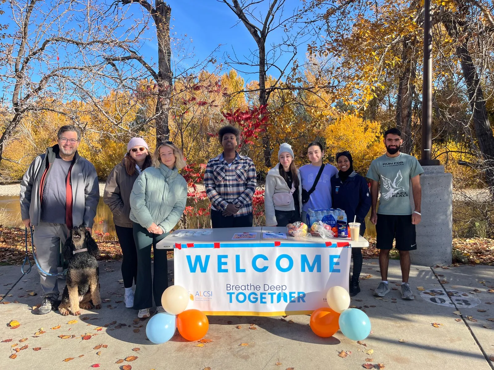 Participants welcoming walkers to a lung cancer awareness event
