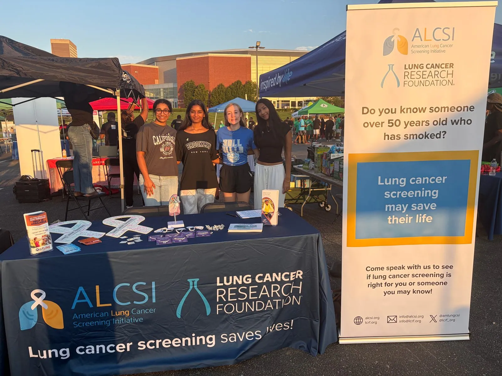 ALCSI volunteers sharing screening information at an outdoor community event