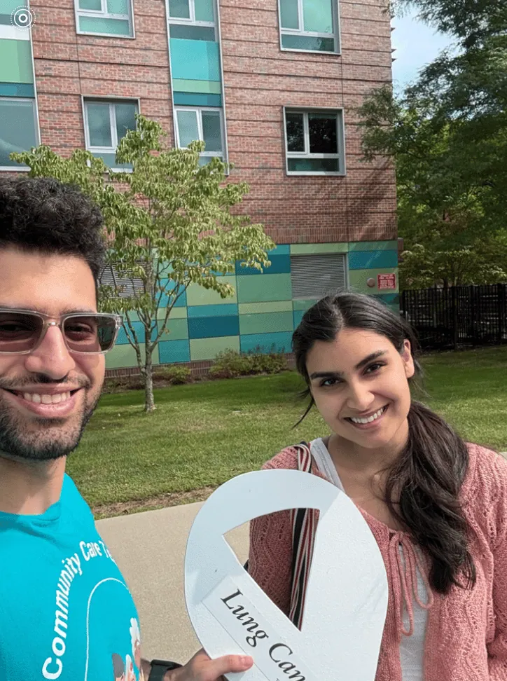 Two ALCSI volunteers together at a community event