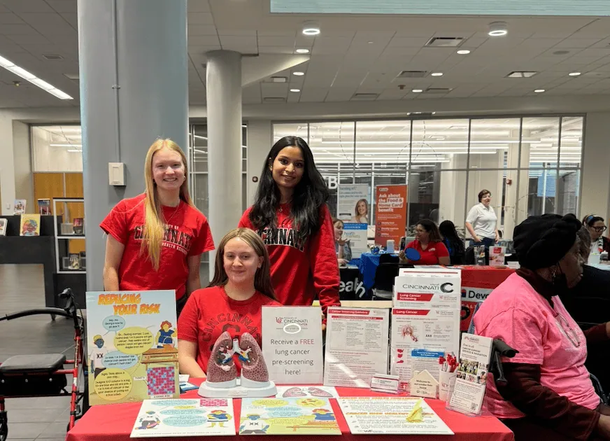 ALCSI volunteers sharing printed screening resources at a health fair