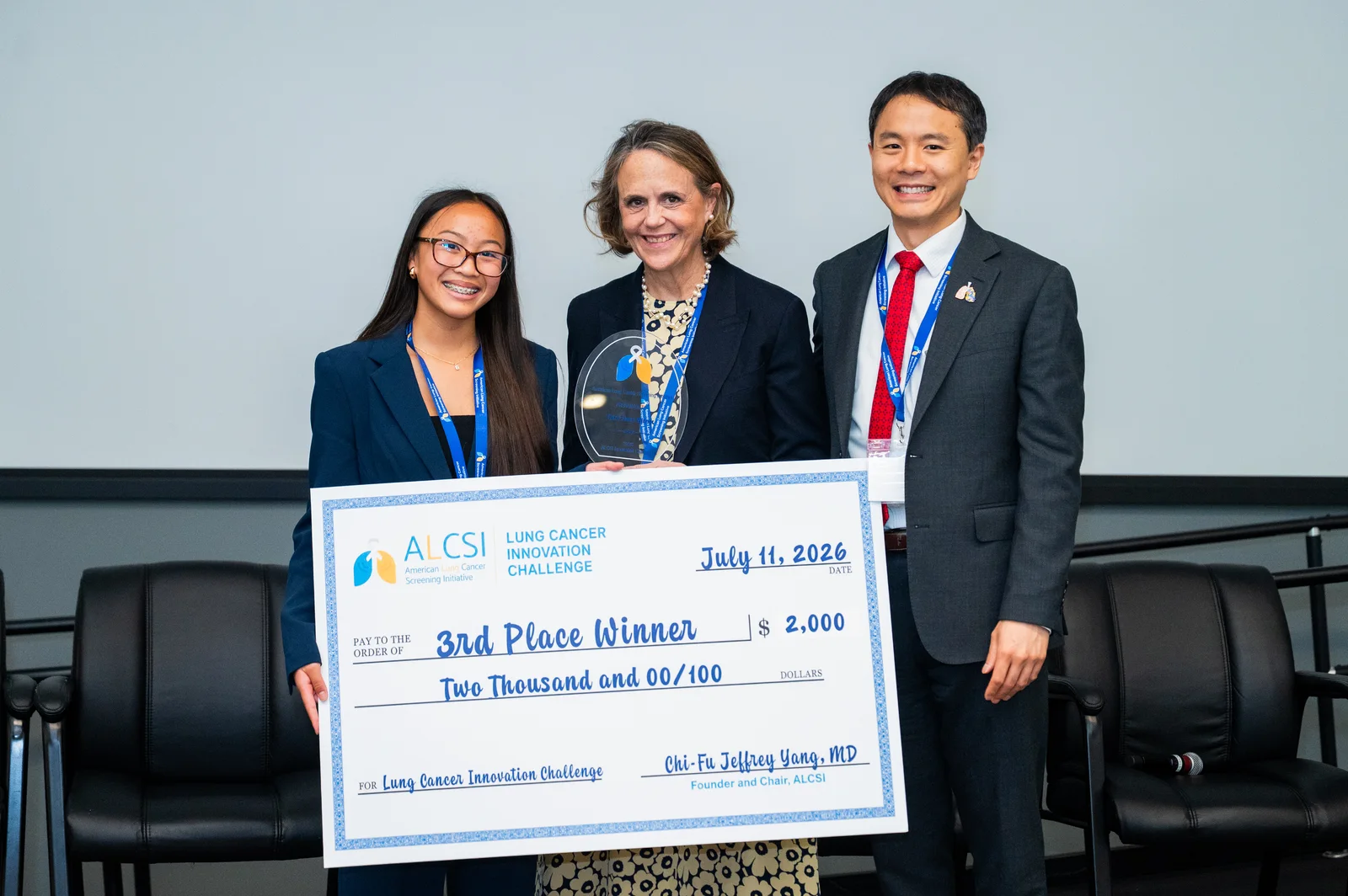 Breath of Remembrance creator receiving the 3rd place check with ALCSI leadership